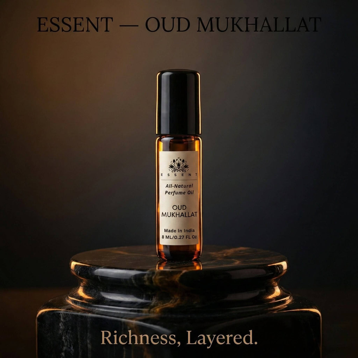 Essent Oud Mukhallat 8 ml roll-on attar bottle — oud & amber