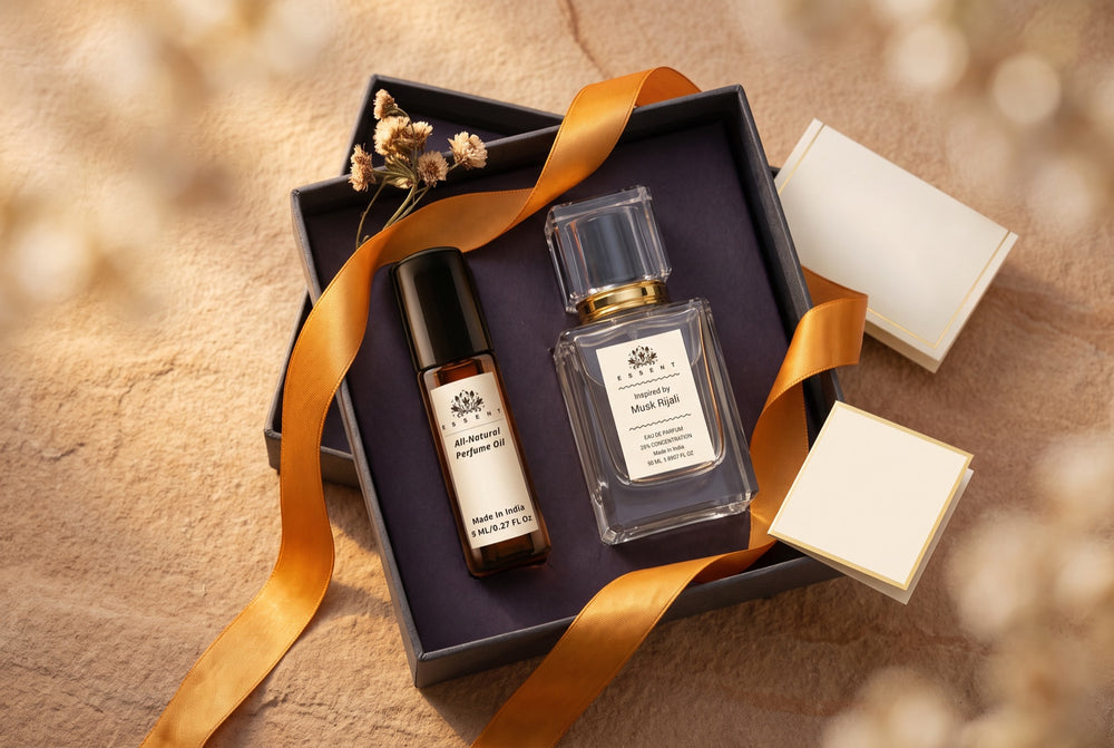 Essent attar bottles arranged in a gift box with ribbon, styled for festival gifting